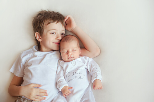Brother and Newborn Sibling
