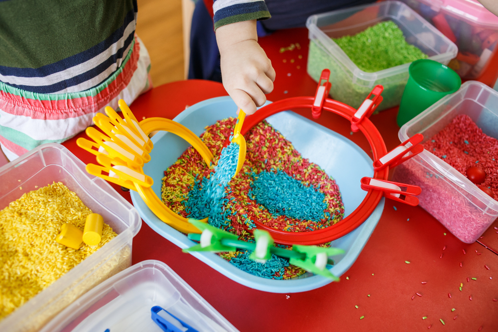 Kids can play with sensory bins while parents work from home